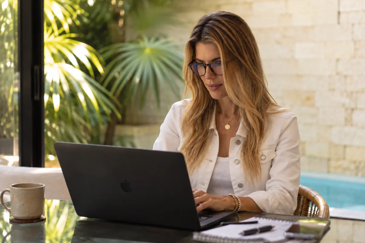 Shirley Mueller reviewing a VA loan application on her laptop
